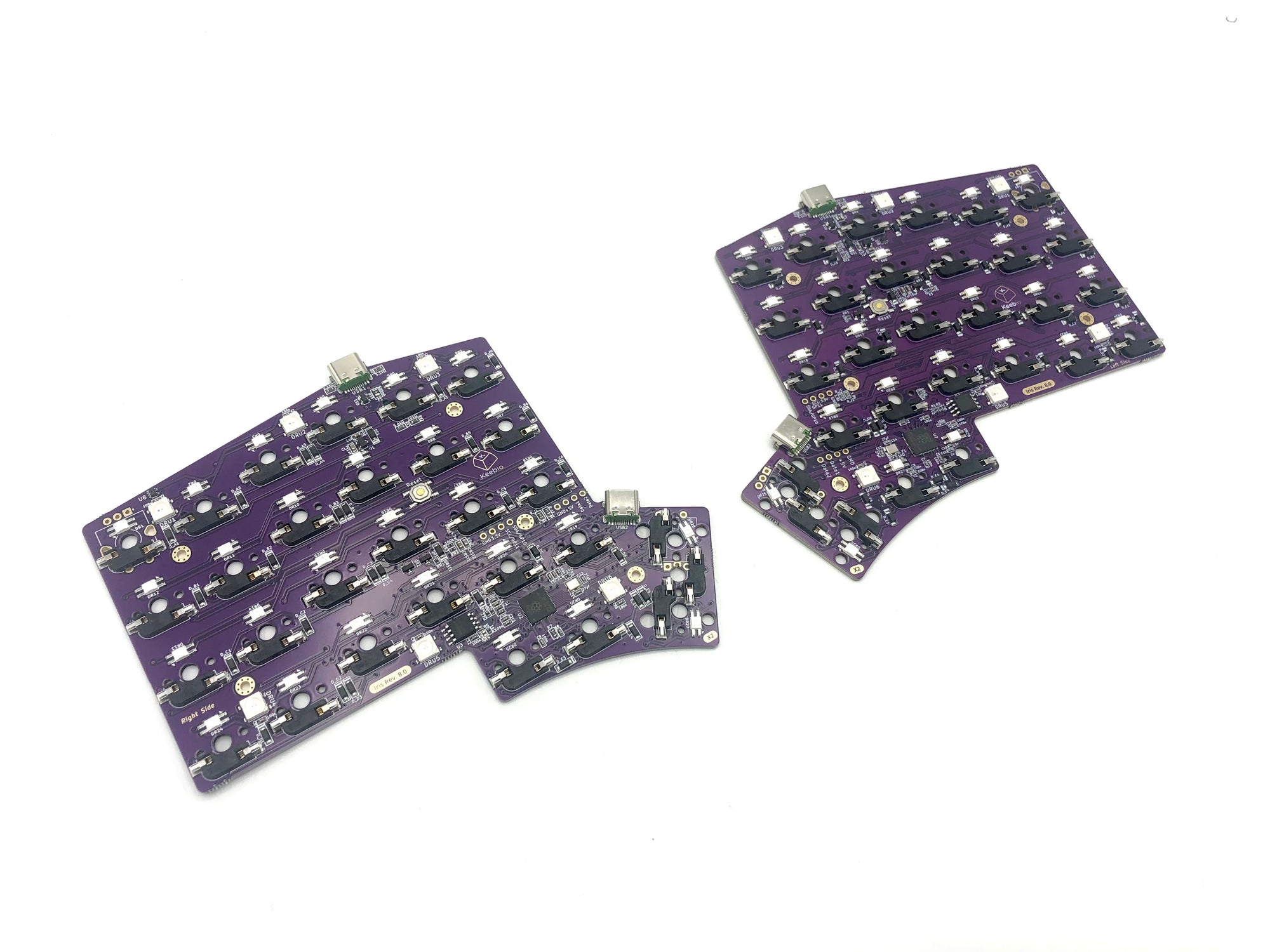 Bare Iris PCB underside with all onboard components, including hotswap sockets and microcontroller.