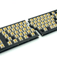 Quefrency keyboard built with yellow and white switches, rotary encoders in the outer corners, and no keycaps.