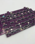 Bare Quefrency PCB halves stacked together.