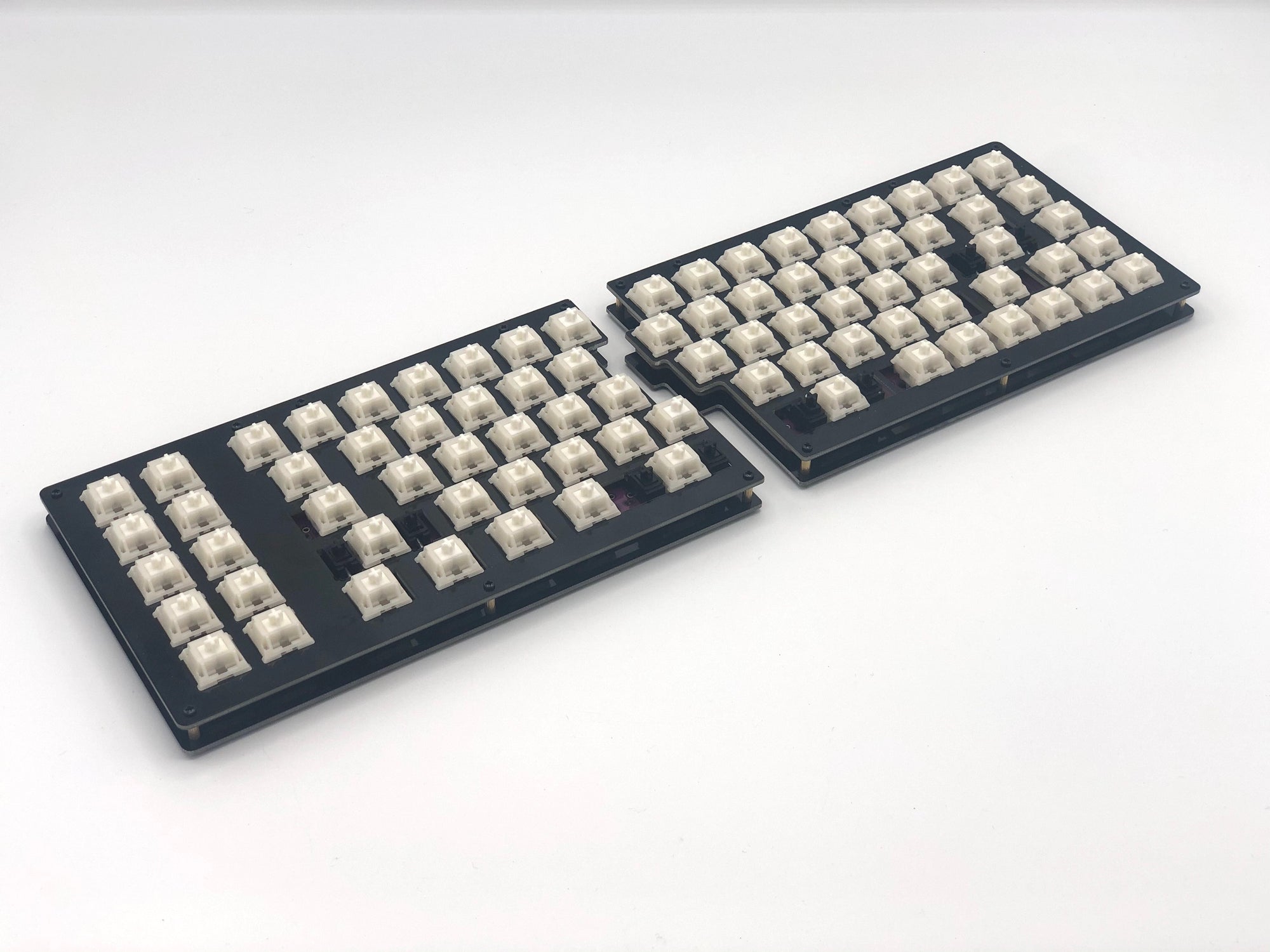 Quefrency keyboard built with white switches and no keycaps.