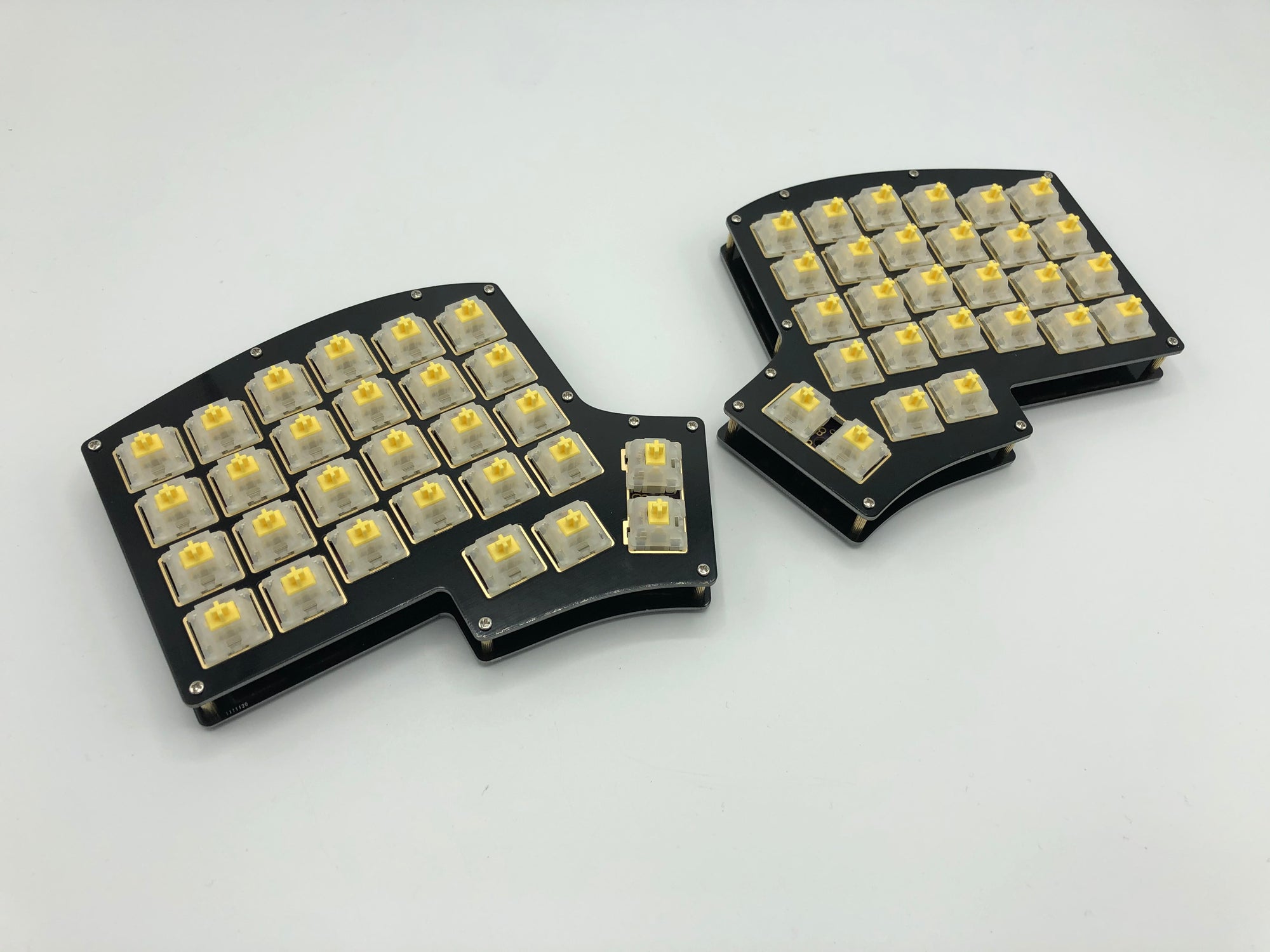 Iris keyboard built with black FR4 plates, Gateron yellow switches, and no keycaps.